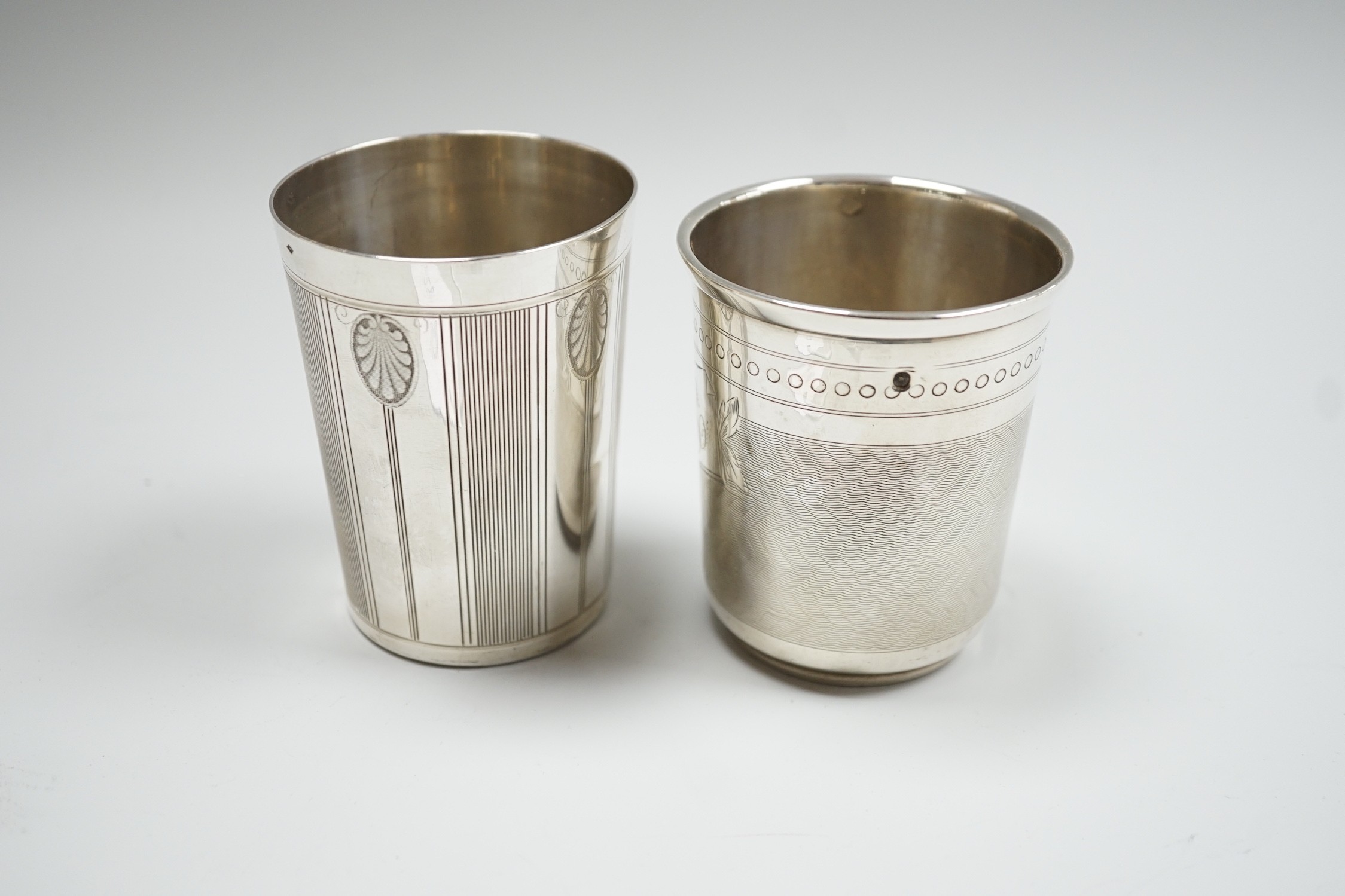 Two early 20th century French engraved 950 standard white metal beakers, tallest 84mm, 4.7oz.